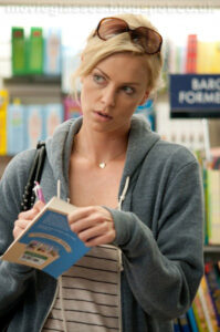 Charlize Theron in Young Adult wearing Dior Sunglasses and signing her book in a book store